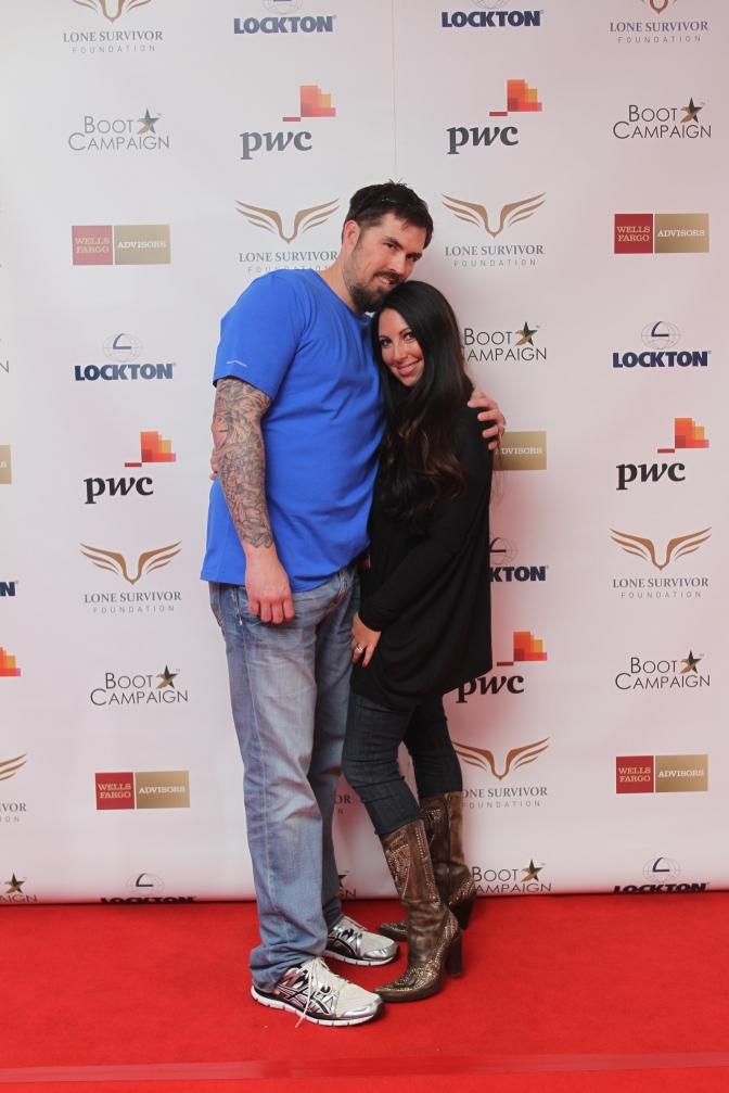 Marcus Luttrell, subject of the film and his wife Melanie pose for a photo on the red carpet.